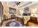 Bright bedroom with hardwood floors, a large bed, and plenty of natural light at 9749 N Fireridge Trl, Fountain Hills, AZ 85268