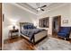 Main bedroom with plush bedding and hardwood floors at 9749 N Fireridge Trl, Fountain Hills, AZ 85268