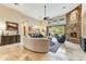 Open living area with large windows, stone fireplace, and high ceilings at 9749 N Fireridge Trl, Fountain Hills, AZ 85268