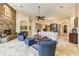 Spacious living area with two armchairs, a stone fireplace and high ceilings at 9749 N Fireridge Trl, Fountain Hills, AZ 85268
