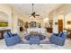 Open living area with a large sofa, stone fireplace and high ceilings at 9749 N Fireridge Trl, Fountain Hills, AZ 85268