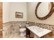 Elegant powder room with ornate mirror and tile flooring at 9749 N Fireridge Trl, Fountain Hills, AZ 85268