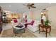 Comfortable living room with a sectional sofa, coffee table, and view to the kitchen at 14414 N 57Th Way, Scottsdale, AZ 85254