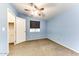Bedroom with ceiling fan and carpet at 17200 W Bell Rd # 1740, Surprise, AZ 85374