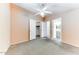Spacious bedroom with ceiling fan and carpet at 17200 W Bell Rd # 1740, Surprise, AZ 85374