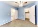 Light blue walls, ceiling fan, and carpet at 17200 W Bell Rd # 1740, Surprise, AZ 85374