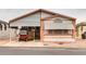 Front view of manufactured home with carport and golf cart at 17200 W Bell Rd # 1740, Surprise, AZ 85374
