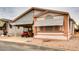 Front view of manufactured home with carport and golf cart at 17200 W Bell Rd # 1740, Surprise, AZ 85374