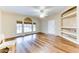 Living room with wood-like floors, built-in shelves and lots of light at 17200 W Bell Rd # 1740, Surprise, AZ 85374