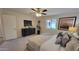 King sized bed in a bright bedroom with a ceiling fan at 2064 S Farnsworth Dr # 18, Mesa, AZ 85209