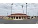 Large community center building with a tile roof and covered entryway at 2064 S Farnsworth Dr # 18, Mesa, AZ 85209