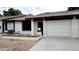 White brick condo with a one-car garage and small front yard at 2064 S Farnsworth Dr # 18, Mesa, AZ 85209