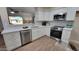 Newly remodeled kitchen with white cabinets and a breakfast nook at 2064 S Farnsworth Dr # 18, Mesa, AZ 85209
