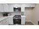 Modern kitchen with white cabinets, stainless steel appliances, and quartz countertops at 2064 S Farnsworth Dr # 18, Mesa, AZ 85209
