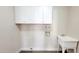 Laundry room with white cabinets and a utility sink at 2064 S Farnsworth Dr # 18, Mesa, AZ 85209