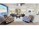 Spacious living room with large window and ceiling fan at 2064 S Farnsworth Dr # 18, Mesa, AZ 85209