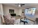 Living room boasts large windows and stylish seating at 2064 S Farnsworth Dr # 18, Mesa, AZ 85209
