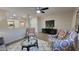 Living room with flat-screen TV and comfortable armchairs at 2064 S Farnsworth Dr # 18, Mesa, AZ 85209