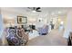Bright living room with comfy seating and a view into the kitchen at 2064 S Farnsworth Dr # 18, Mesa, AZ 85209