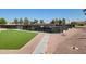 Multiple well-lit pickleball courts with green artificial turf at 2064 S Farnsworth Dr # 18, Mesa, AZ 85209