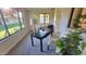 Bright sunroom with window seating and desk at 2064 S Farnsworth Dr # 18, Mesa, AZ 85209