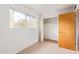 Bedroom with window, closet, and neutral walls at 2449 W Missouri Ave, Phoenix, AZ 85015