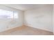 Simple bedroom with tiled floors and a window at 2449 W Missouri Ave, Phoenix, AZ 85015