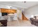Small kitchen with wooden cabinets and bar seating at 2449 W Missouri Ave, Phoenix, AZ 85015