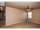 Bright bedroom with carpeted floor and ceiling fan at 2542 N Riley Rd, Buckeye, AZ 85396