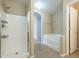 Bathroom with shower and bathtub at 2665 W Goldmine Mountain Dr, San Tan Valley, AZ 85144