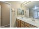 Double vanity bathroom with a large mirror and ample storage at 2665 W Goldmine Mountain Dr, San Tan Valley, AZ 85144