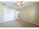 Well-lit bedroom with double door closet and ceiling fan at 2665 W Goldmine Mountain Dr, San Tan Valley, AZ 85144