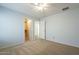 Spacious bedroom with ceiling fan and adjacent closet at 2665 W Goldmine Mountain Dr, San Tan Valley, AZ 85144