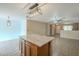 Kitchen island and view into living room at 2665 W Goldmine Mountain Dr, San Tan Valley, AZ 85144