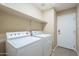 Laundry room with washer, dryer and shelving at 2665 W Goldmine Mountain Dr, San Tan Valley, AZ 85144
