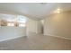Open living space with tile floors and neutral walls at 2665 W Goldmine Mountain Dr, San Tan Valley, AZ 85144