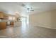 Living room with tile floor and kitchen view at 2665 W Goldmine Mountain Dr, San Tan Valley, AZ 85144