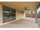 Covered patio with ceiling fan and sliding glass door at 2665 W Goldmine Mountain Dr, San Tan Valley, AZ 85144