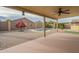 Backyard with kidney-shaped pool and covered patio at 2665 W Goldmine Mountain Dr, San Tan Valley, AZ 85144