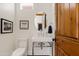 Small bathroom with pedestal sink and toilet at 29441 N 64Th St, Cave Creek, AZ 85331