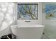 Modern bathroom with freestanding tub, walk-in shower, and large window at 29441 N 64Th St, Cave Creek, AZ 85331