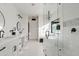 Bright bathroom with double vanity, large mirrors, and a modern design at 29441 N 64Th St, Cave Creek, AZ 85331