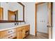 Bathroom with wood vanity, quartz countertop, and a large mirror at 29441 N 64Th St, Cave Creek, AZ 85331