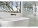 Modern bathroom with freestanding tub and shower at 29441 N 64Th St, Cave Creek, AZ 85331