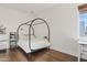 Bedroom with canopy bed and hardwood floors at 29441 N 64Th St, Cave Creek, AZ 85331