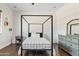 Bedroom with a four-poster bed and wood floors at 29441 N 64Th St, Cave Creek, AZ 85331