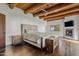 Main bedroom with wood beams, fireplace, and hardwood floors at 29441 N 64Th St, Cave Creek, AZ 85331