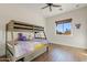 Bedroom with bunk beds and a view of the backyard at 29441 N 64Th St, Cave Creek, AZ 85331