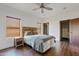 Bedroom with a bed, nightstand, and access to a closet at 29441 N 64Th St, Cave Creek, AZ 85331