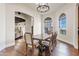 Elegant dining room featuring hardwood floors and arched windows at 29441 N 64Th St, Cave Creek, AZ 85331